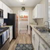 galley kitchen with access to laundry room